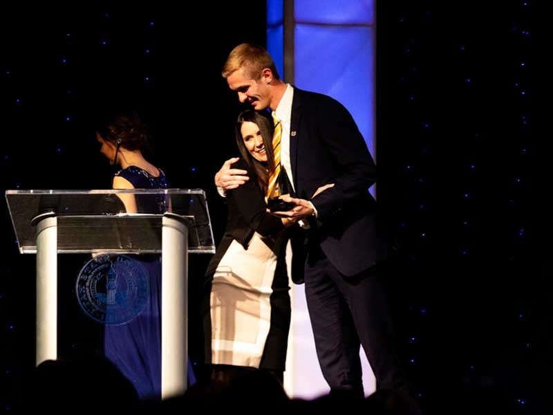 Michael Scott Peters receiving the Man of the Year award