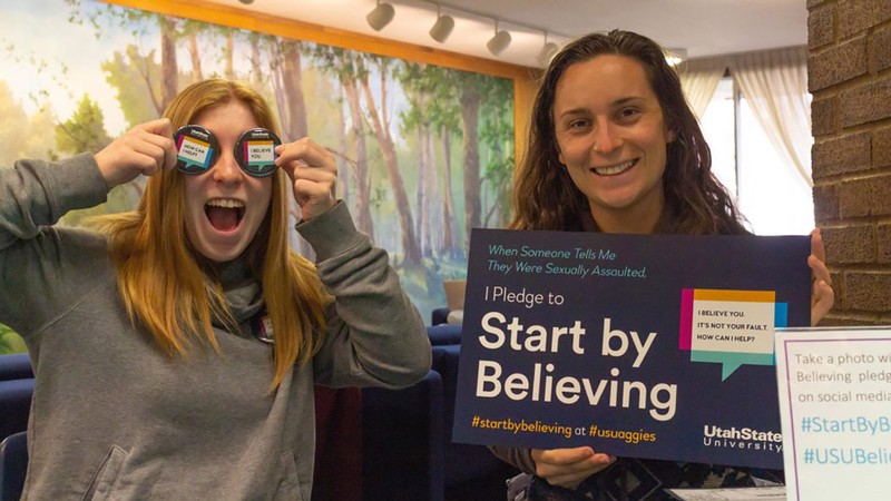 Two SAAVI volunteers hold the