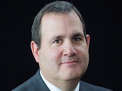 Niel Holt, director of the USU Research Foundation's Space Dynamics Laboratory