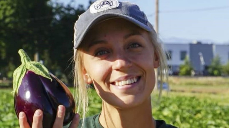 Sam Fitch holding and eggplant.