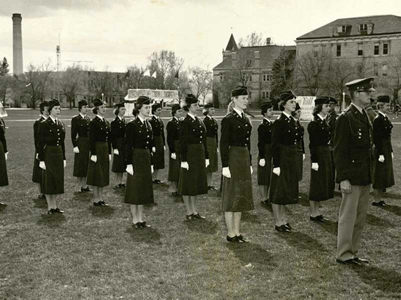 Utah State University Sponsor Corp stands at attention on the Quad