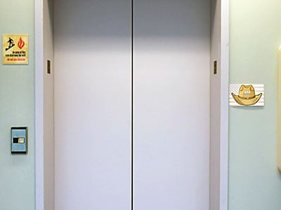 an elevator door photo illustraion of anniversity of Americans with Disabilities Act