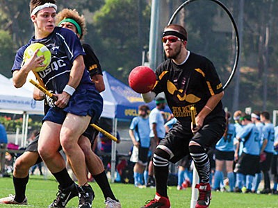 Members of the USU Quidditch team on the field