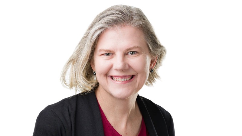 A woman poses for a headshot.