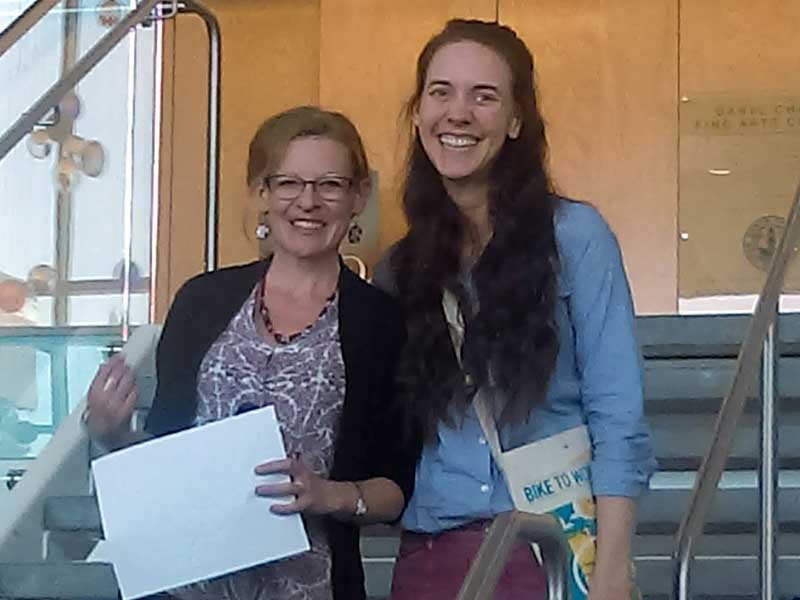 Heidi Hart receives the Sustainability Educator Award from Alexi Lamm