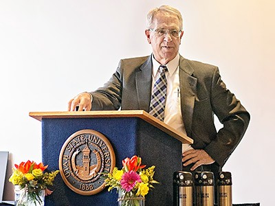 USU President Stan Albrecht at the Sustainability Symposium and awards