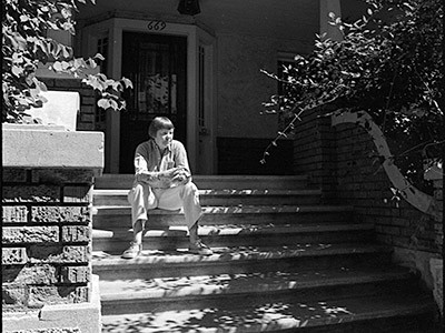 Poet May Swenson on the front steps of her family home in the 1940s