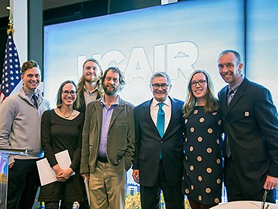 Stafff members from USU's Center for Civic Engagement and Service-Learning accepting a grant award