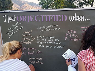students at a chalkboard for the 'Objectified' project