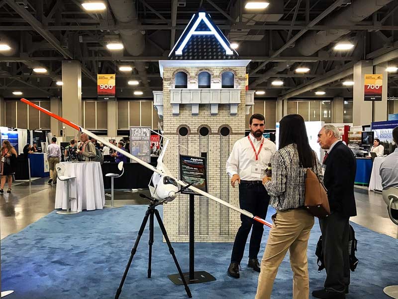 Aerospace engineering master’s student Matthew Givens speaks with visitors