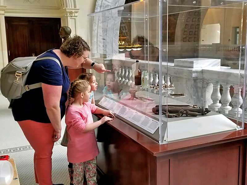people looking at the exhibit