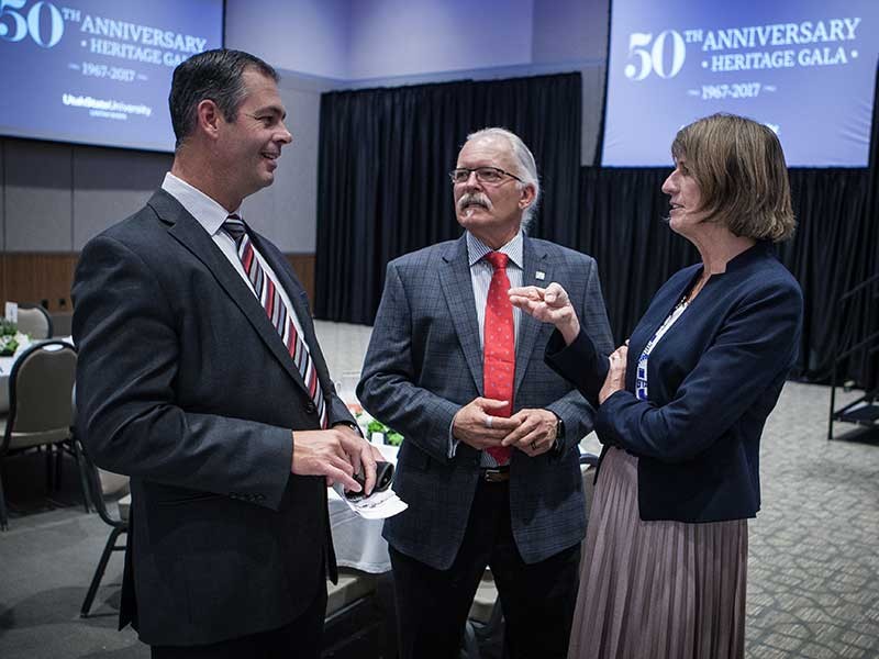 Superintendent Mark Dockins, Vice Provost Rich Etchberger and USU President Noelle Cockett