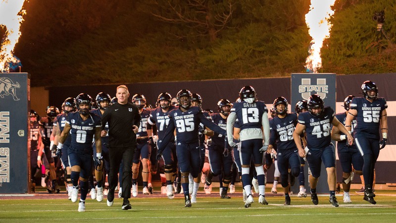 The USU football team takes the field during a game at Colorado State University on Oct. 22.