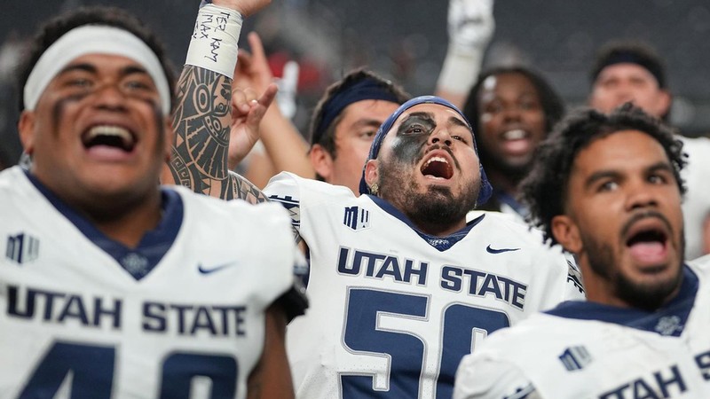 USU football players.