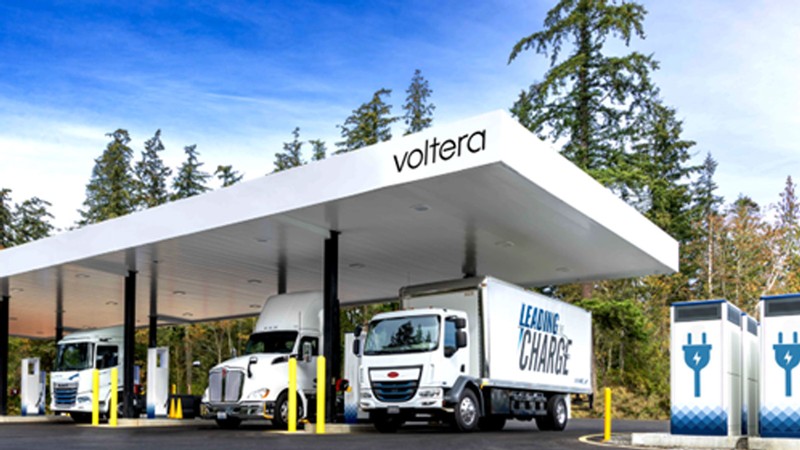 Ellectric trucks in a charging depot.