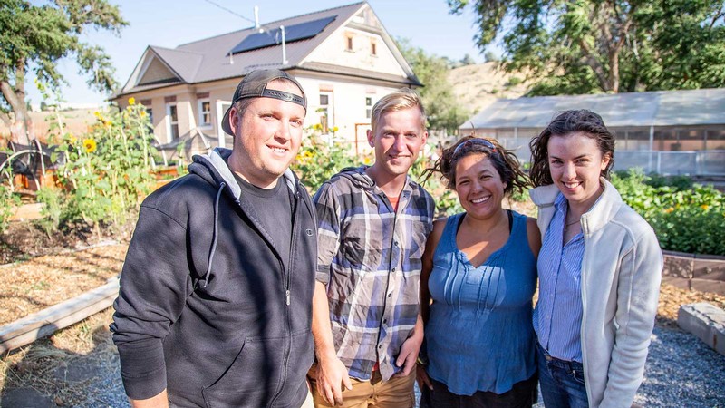Group of four USU VISTA volunteers pose for a photo.