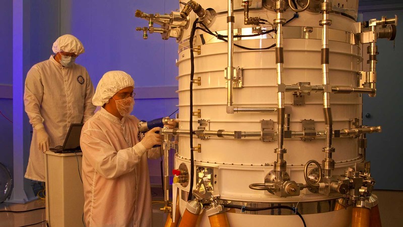 engineers from the Space Dynamics Laboratory working on the WISE telescope at SDL.