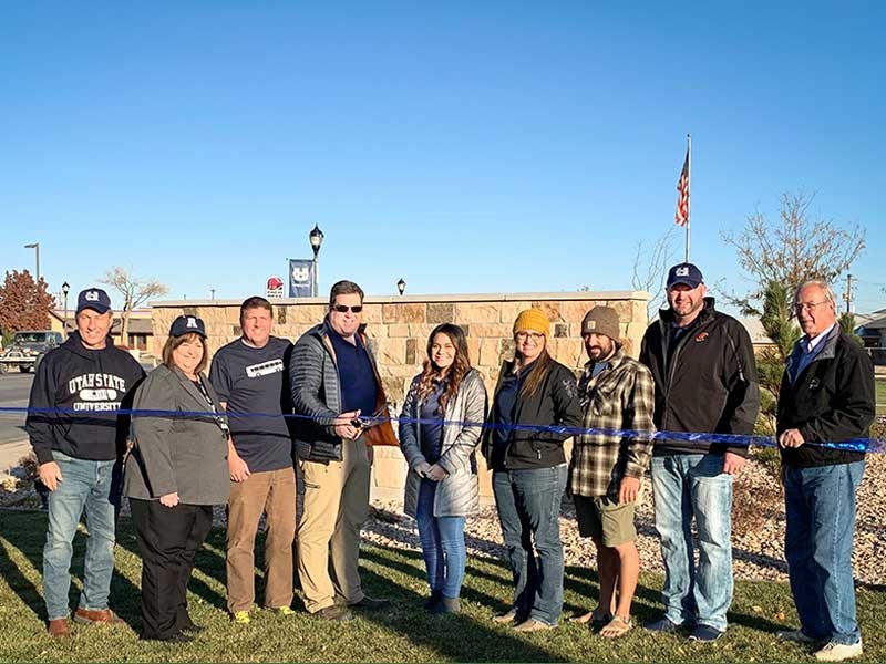 A group gathered at the ribbon cutting