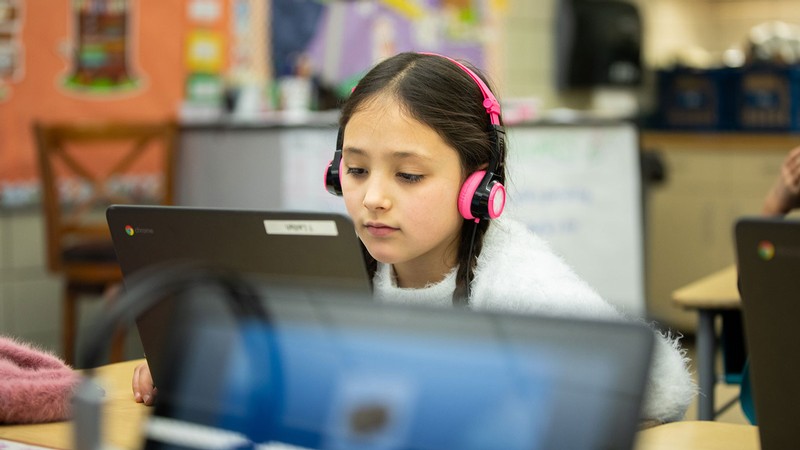 Girl playing Whyville on a computer.