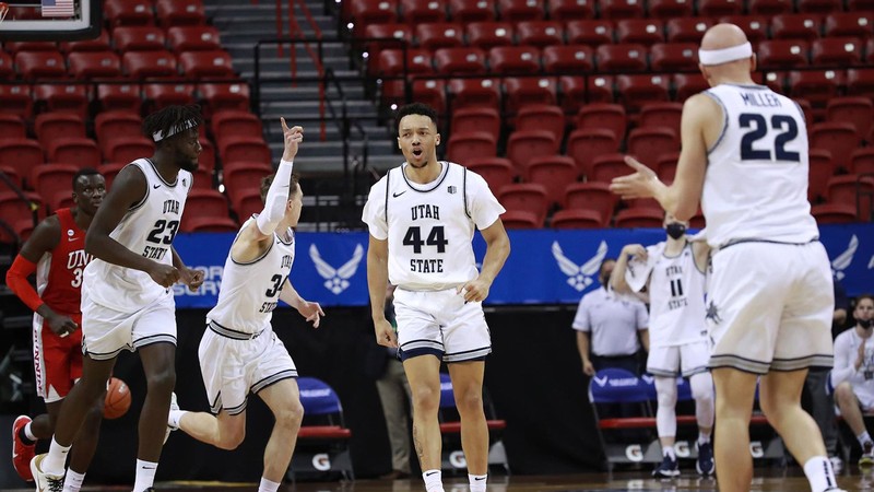 USU men's basketball team on the court.