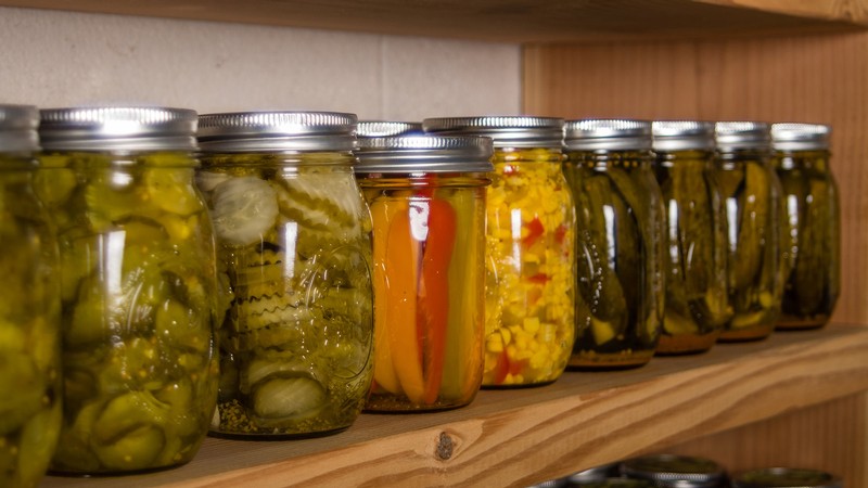 Canned food on a shelf.