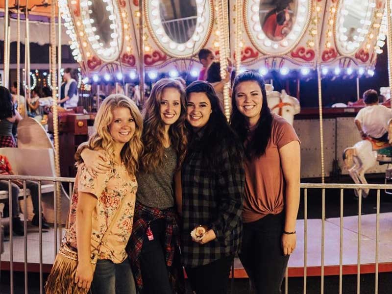 four women gathered together