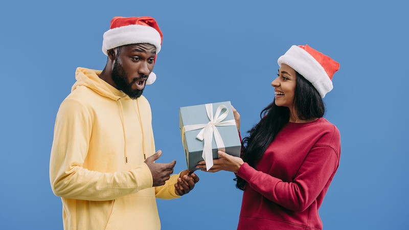 couple giving each other a gift.