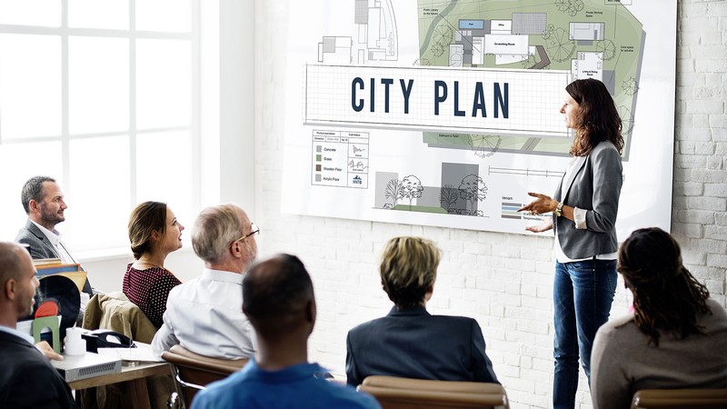 woman giving a city plan presentation.