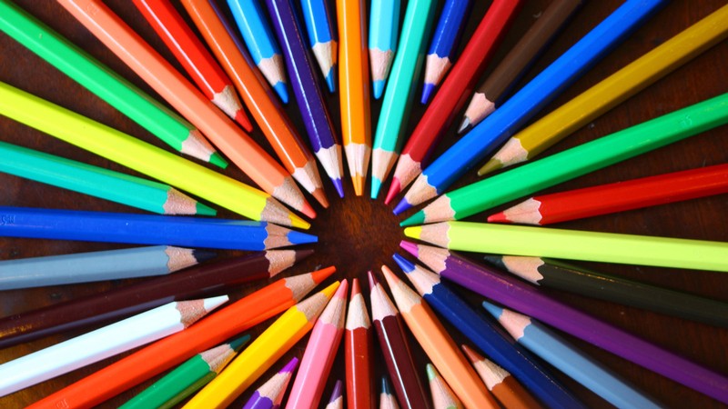 colored pencils in a rainbow pattern.
