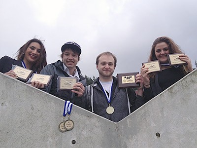 USU debate team members with awards