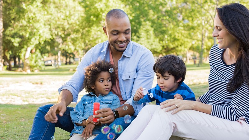 parents sitting with children in their laps.