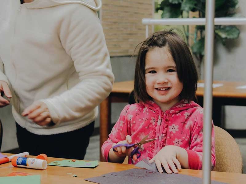 child participating in art project