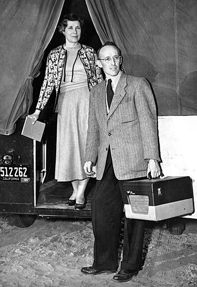Folklorists Austin and Alta Fife with travel trailer