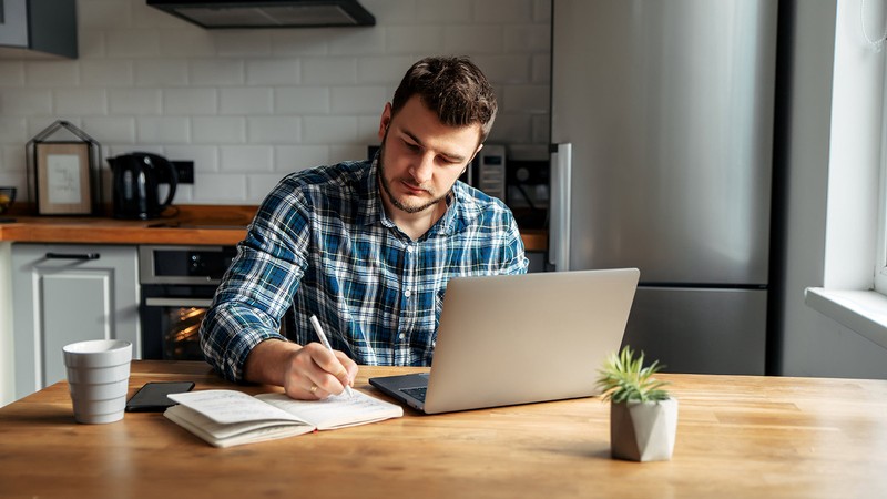 Man studying at a computer.