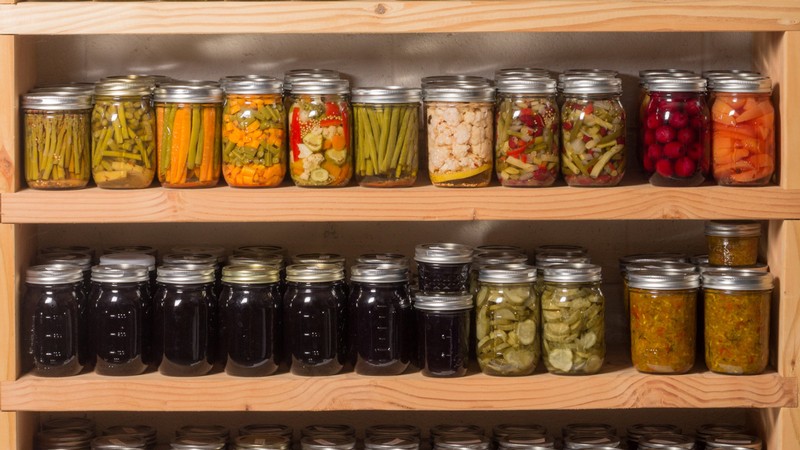 Canned food on a shelf.
