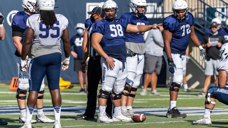 USU football players on the field.