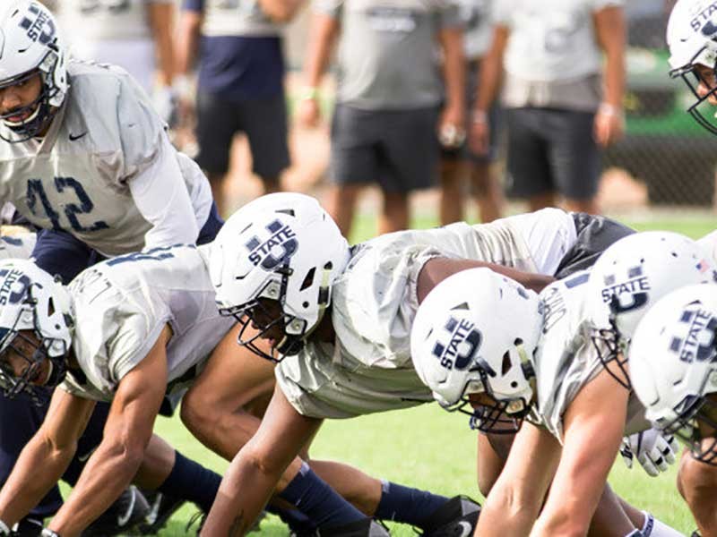 USU football players in scrimmage