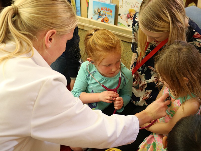 little girls using with stethoscope