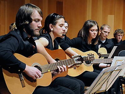 members of a USU guitar ensemble performing