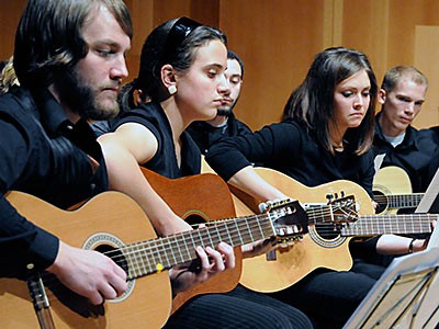 members of a USU guitar ensemble performing