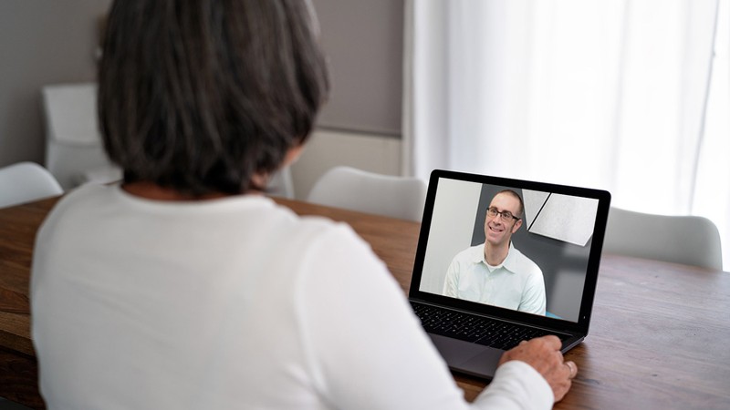 Mike Twohig, Psychology professor, counsels a client via Telehealth.