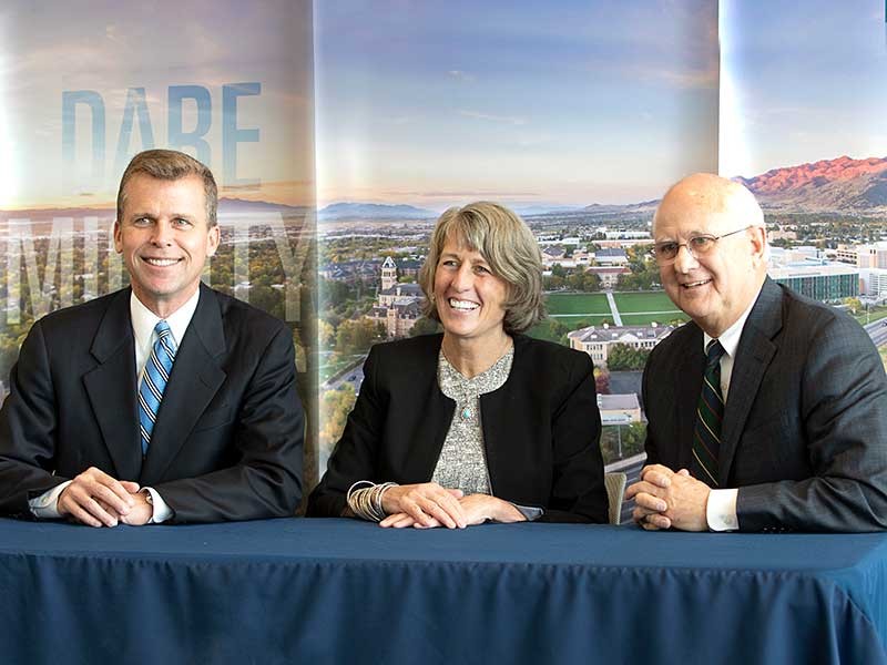 USU President Noelle Cockettwith David Huntsman and Douglas Anderson.