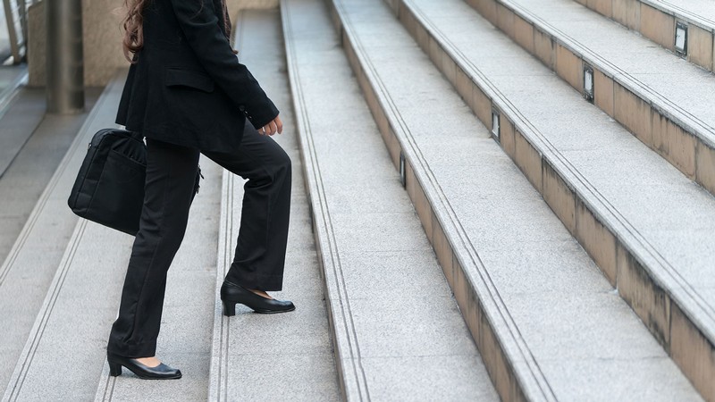 woman climbing stairs