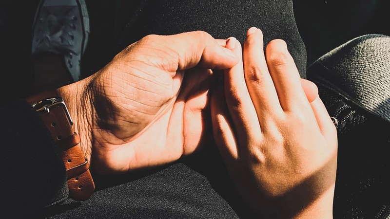 hands folded together.