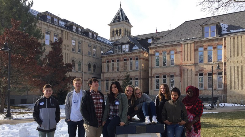 students gathered around the Block A under Old Main