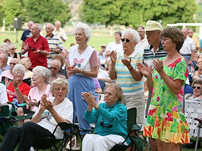 audience members at an outdoor USU Alumni Band concert