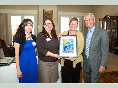 Campus Compact honoree Dennise Gackstetter with administrators at award ceremony