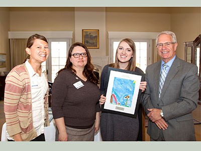 Hannah Pendergast, Campus Compact honoree with administrators and guests at award ceremony