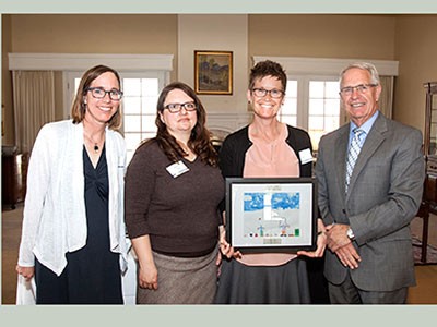 Kristine Miller and administrators at Campus Compact award ceremony