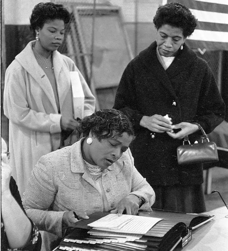 three women voting in 1965.